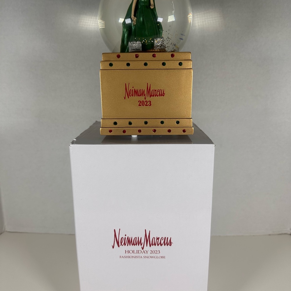 Neiman Marcus Holiday 2023 Fashionista Snowglobe Lady in Green and Shopping Bags